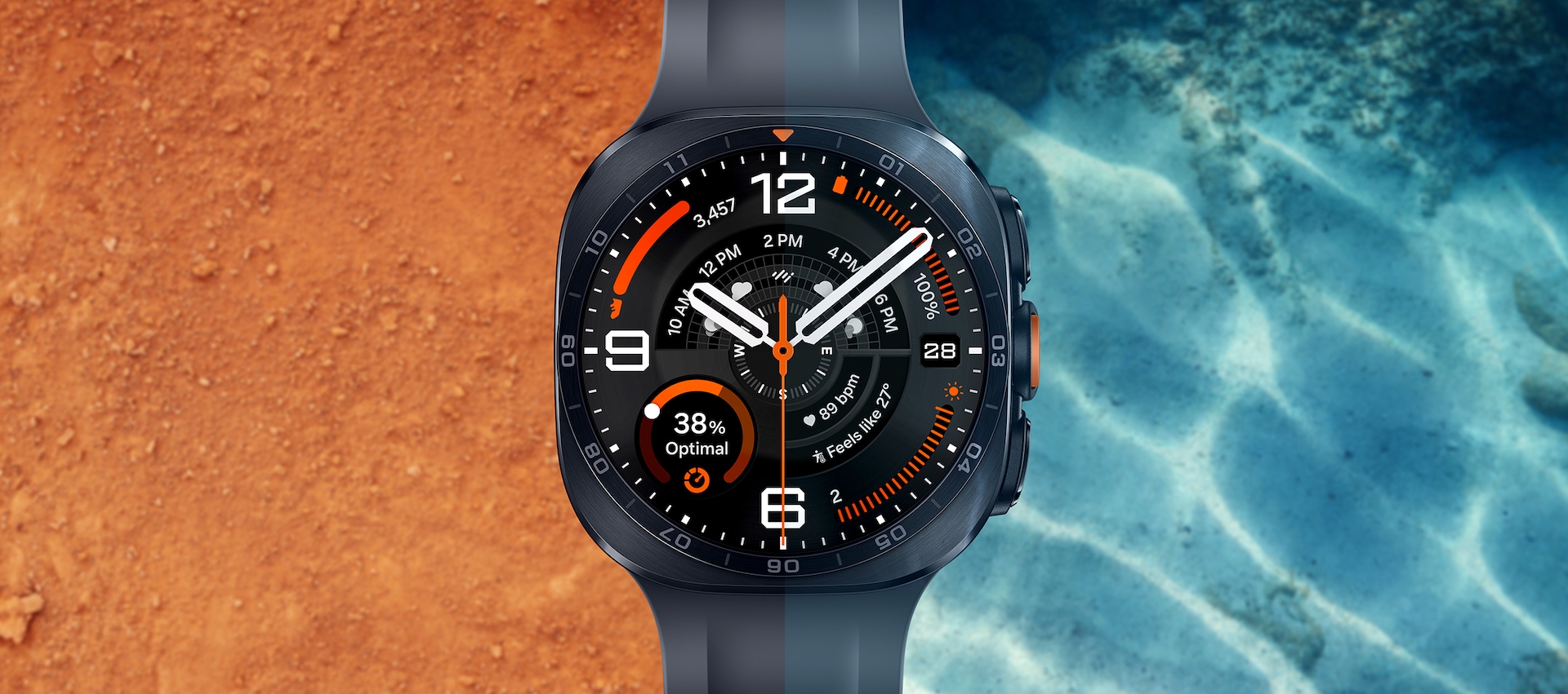 Galaxy Watch Ultra2 kijelzője homokos és vizes háttér előtt.